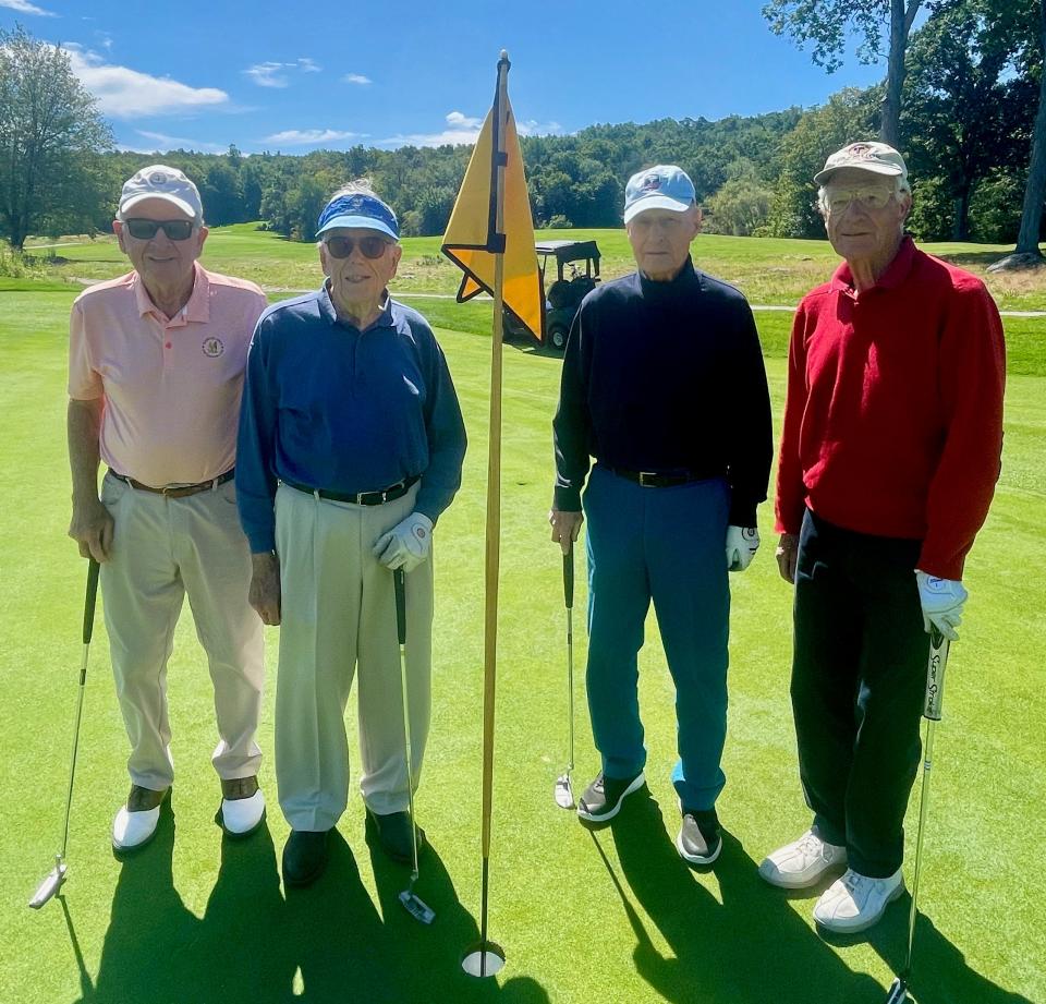 From left, Bill McKenna, Joe Oakley, Jack Keegan and John Peterson stand on the ninth green after they played nine holes Thursday at Tatnuck Country Club.