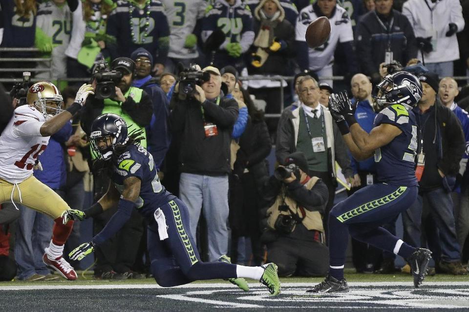 Malcolm Smith's interception off a pass Richard Sherman deflected is one of the greatest moments in NFC championship game history. (AP)