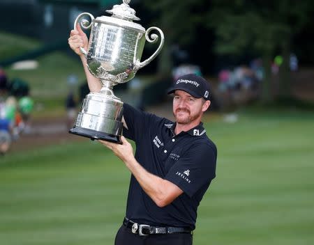 Jul 31, 2016; Springfield, NJ, USA; PGA golfer Jimmy Walker holds up the Wanamaker Trophy after winning the 2016 PGA Championship golf tournament at Baltusrol GC - Lower Course. Mandatory Credit: Brian Spurlock-USA TODAY Sports