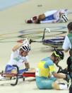 2016 Rio Olympics - Cycling Track - Final - Men's Omnium 40km Points Race - Rio Olympic Velodrome - Rio de Janeiro, Brazil - 15/08/2016. Elia Viviani (ITA) of Italy reacts after the crash with Glenn O'Shea (AUS) of Australia. REUTERS/Paul Hanna