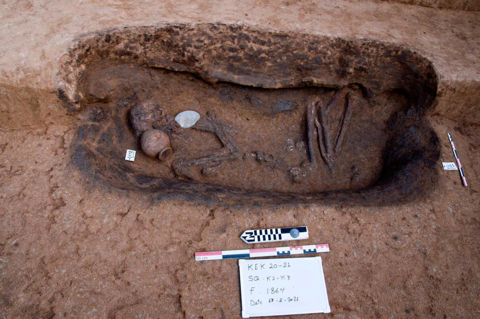 This photo provided by the Egyptian Tourism and Antiquities Ministry on Tuesday, April 27, 2021, shows an ancient burial tomb unearthed recently with human remains and and pottery, in the Koum el-Khulgan archeological site, in the Nile Delta province of Dakahlia, around 150 kilometers (93 miles) northeast of Cairo, Egypt. Archeologists unearthed 110 burial tombs in the ancient site in a Nile Delta province, Tourism and Antiquities Ministry said on Tuesday. (Egyptian Tourism and Antiquities Ministry via AP)