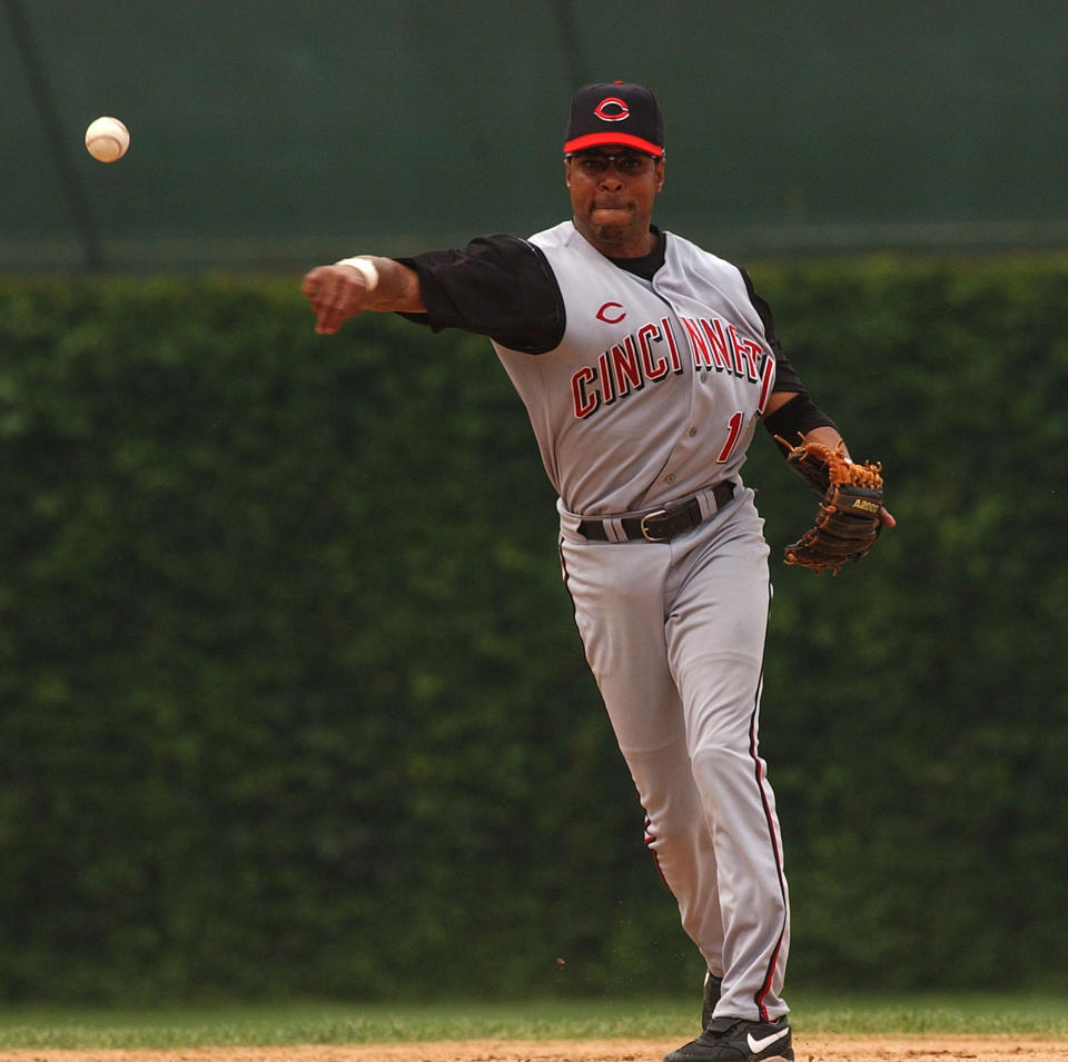 CHICAGO - FILE: Barry Larkin #11 of the Cincinnati Reds overthrows first base early during a game against the Chicago Cubs on July 21, 2004 at Wrigley Field in Chicago, Illinois. It was reported that former Cincinnati Reds shortstop Barry Larkin was elected to the Baseball Hall of Fame January 9, 2012. (Photo by Jonathan Daniel/Getty Images)