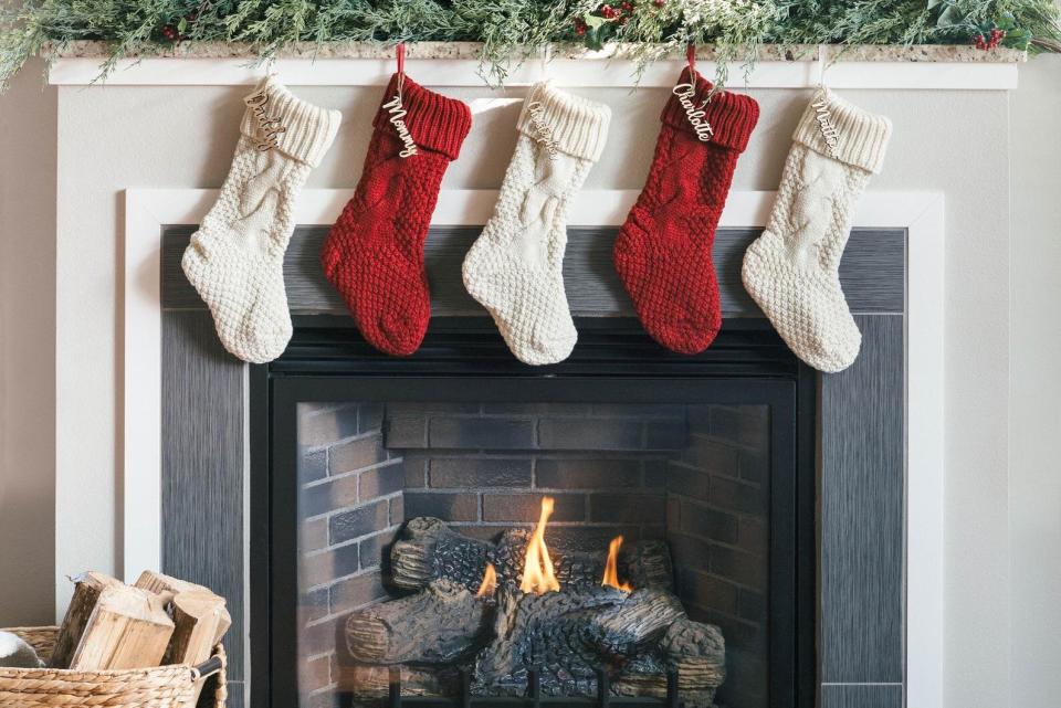 For the last few Christmases, my boyfriend and I have used those cheap, undoubtedly flammable, red and white stockings I probably picked up from a K-Mart on my way home from work one evening. But this year, with us spending more time at home than ever before, I wanted to buy us some cute and <a href="https://fave.co/3fZsDtV" target="_blank" rel="noopener noreferrer">personalized stockings</a> we'd be happy to pull out year after year. Most of the personalized stockings options on Etsy were already sold out, but I spotted this <a href="https://fave.co/3fZsDtV" target="_blank" rel="noopener noreferrer">cute option</a> that comes with custom, personalized wooden name tags. You can choose both a knit stocking (red or white!) and a personalized name tag, or you can just select the wooden name tags, if you have your own favorite stockings at home already. Best of all, they arrived in about a week! - <strong>Brittany Nims, Head Of HuffPost Finds</strong><br /><br /><a href="https://fave.co/3fZsDtV" target="_blank" rel="noopener noreferrer">Find it starting for $7 on Etsy</a>.