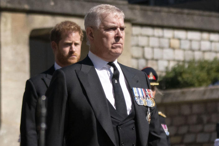 FILE — Prince Andrew, foreground, walks in the procession ahead of Britain Prince Philip's funeral at Windsor Castle, Windsor, England, April 17, 2021. When Jeffrey Epstein’s longtime companion Ghislaine Maxwell goes on trial next week, the accuser who captivated the public most, with claims she was trafficked to Britain’s Prince Andrew and other prominent men, won’t be part of the case.(Victoria Jones/Pool via AP, File)