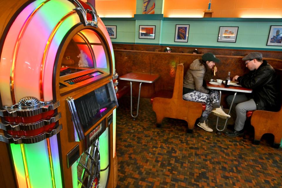 Dan Gable and Kimberly Hawkey, both of Worcester, have a date by the jukebox that plays CDs at George's Coney Island Hot Dogs.