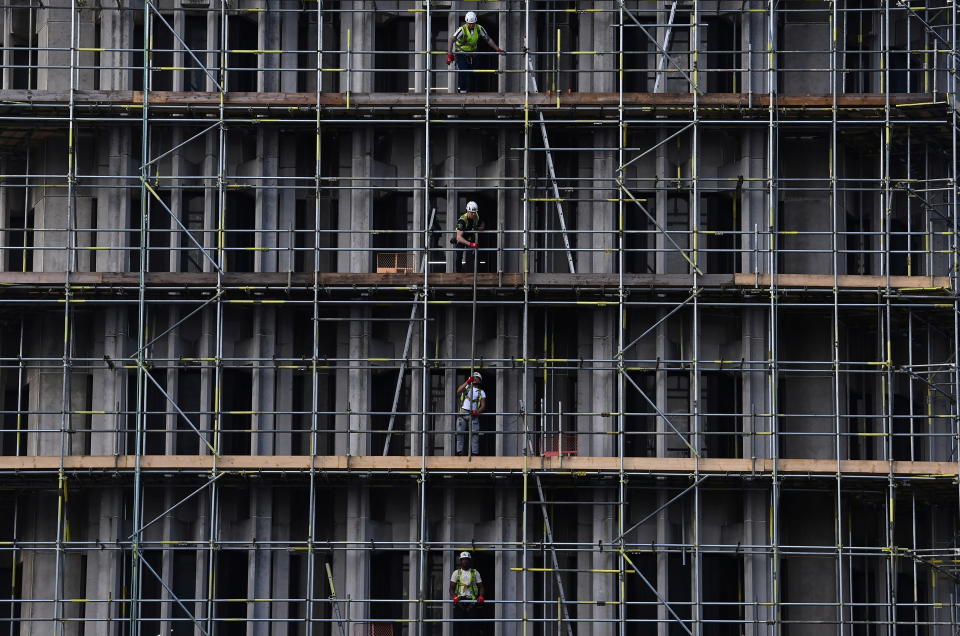 Berkeley  Scaffolders work on a construction site in London, Britain, October 20, 2021. REUTERS/Toby Melville