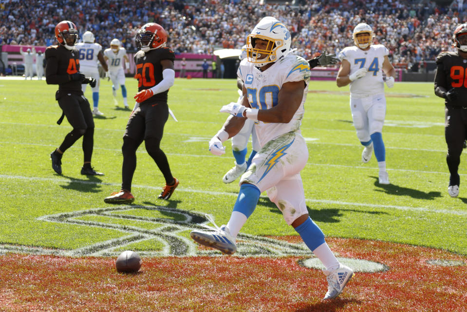 Los Angeles Chargers running back Austin Ekeler (30) spikes the ball after running in for a touchdown against the Cleveland Browns during the first half of an NFL football game, Sunday, Oct. 9, 2022, in Cleveland. (AP Photo/Ron Schwane)