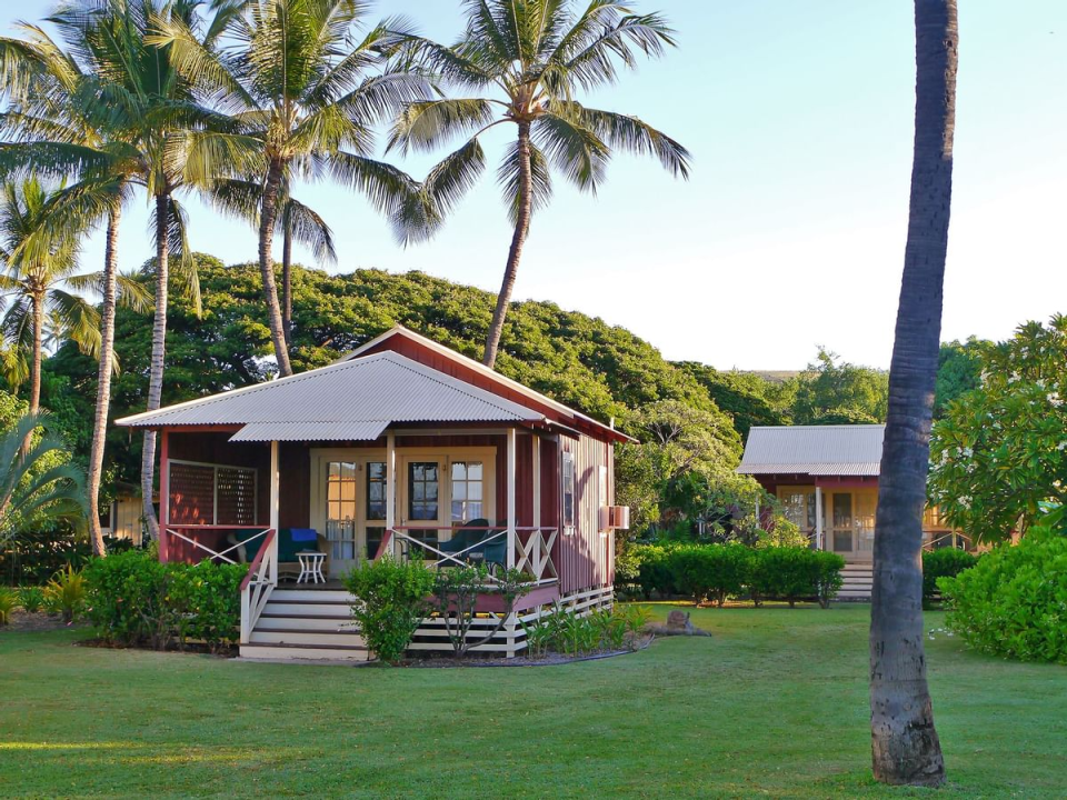 Charming one to three bedroom cottages overlook lush green vegetation (Waimea Plantation Cottages, Kauai)
