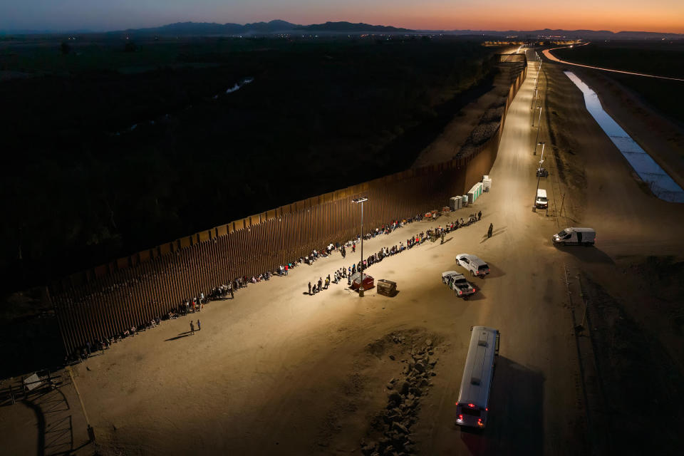 Aerial view of immigrants waiting to be processed by the U.S. Border Patrol after crossing the border from Mexico on June 23, 2022, in Yuma, Arizona. / Credit: Qian Weizhong/VCG via Getty Images