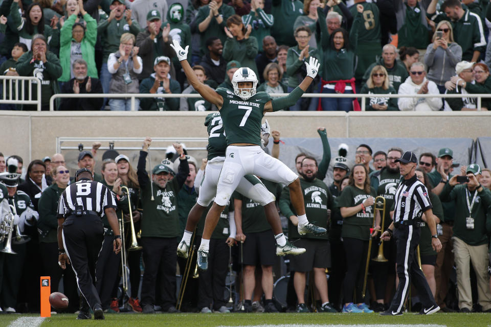 Michigan State's Cody White (7) and Darrell Stewart celebrate Stewart's touchdown reception against Indiana during the second quarter of an NCAA college football game, Saturday, Sept. 28, 2019, in East Lansing, Mich. (AP Photo/Al Goldis)