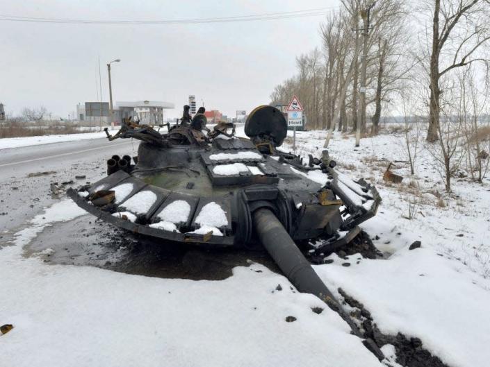 A fragment of a destroyed Russian tank is seen on the roadside on the outskirts of Kharkiv on February 26, 2022.