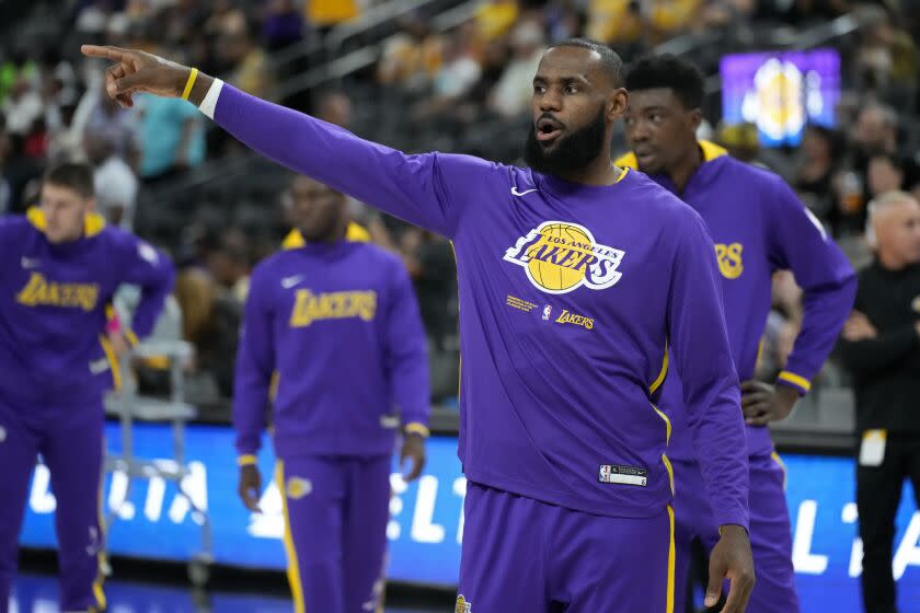 Lakers forward LeBron James warms up before a preseason game