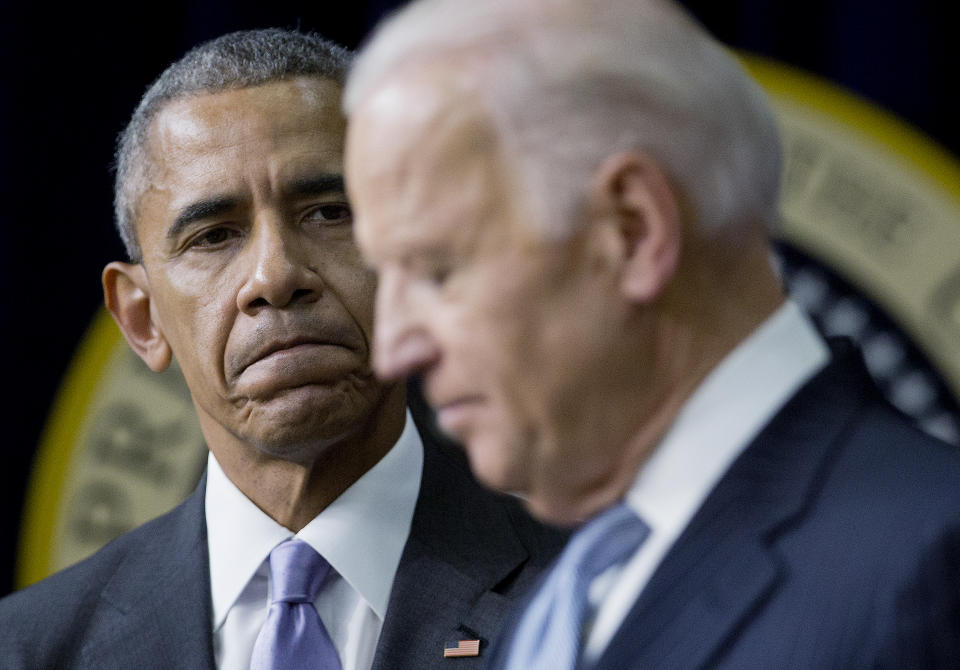 President Barack Obama listens to Vice President Joe Biden make remarks before signing the 21st Century Cures Act, Tuesday, Dec. 13, 2016, in the South Court Auditorium in the Eisenhower Executive Office Building on the White House complex in Washington. (AP Photo/Pablo Martinez Monsivais)