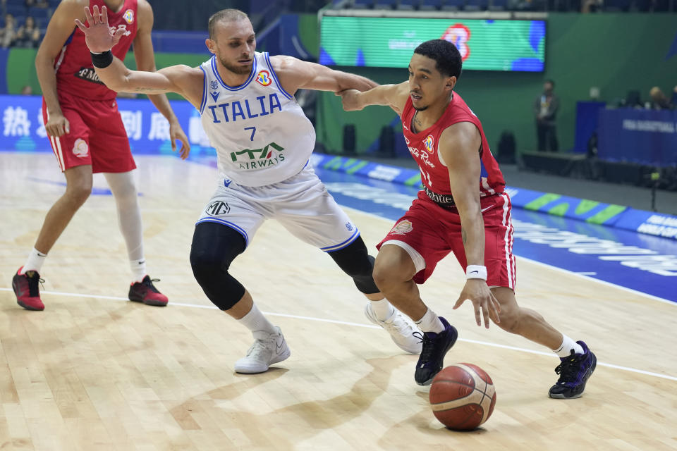 Puerto Rico guard Tremont Waters (51) dribbles past Italy guard Stefano Tonut (7) during their Basketball World Cup second round match at the Araneta Coliseum, Manila, Philippines on Sunday Sept. 3, 2023. (AP Photo/Aaron Favila)