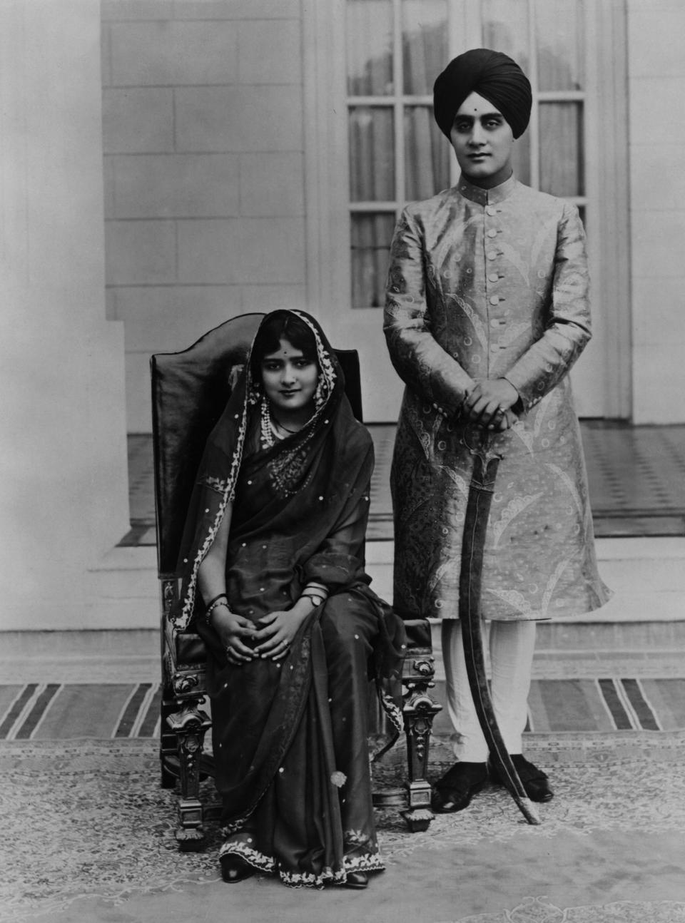 Portrait of newlywed Indian couple Sita Devi (1915 - 2002) (left) and Karamjit Singh (1896 - 1967) during their honeymoon, Paris, France, late 1920s. Devi was 13 years old at the time of their marriage. (Photo by Soibelman Syndicate Collection/Visual Studies Workshop/Getty Images)
