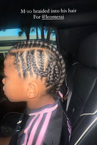 <p>Kim Kardashian/Instagram</p> Kim Kardashian shares a photo of son Saint's hair braided to honor his favorite soccer player.