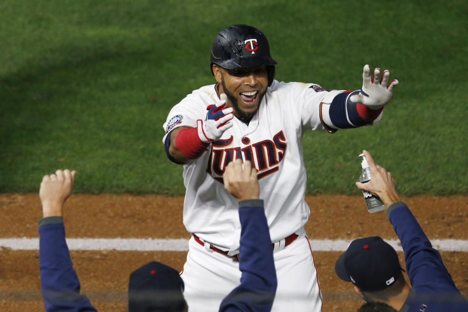 Minnesota Twins' Nelson Cruz celebrates his game-winning RBI off Pittsburgh Pirates pitcher Nick Burdi in the ninth inning of a baseball game Monday, Aug. 3, 2020, in Minneapolis. The Twins won 5-4. (AP Photo/Jim Mone)