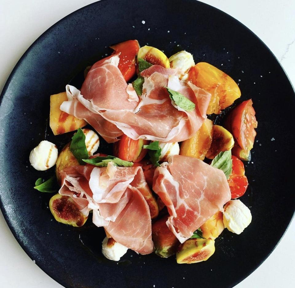 An heirloom tomato appetizer with prosciutto, on 618's holiday menu.