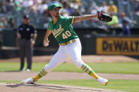 FILE - Oakland Athletics pitcher Chris Bassitt winds up during the team's baseball game against the Seattle Mariners in Oakland, Calif., Sept. 23, 2021. Bassitt, who made a remarkable recovery from a frightening line drive to the head last year, was traded by the Athletics to the New York Mets on Saturday, March 12, for a pair of minor league pitchers. The Mets sent right-handers J.T. Ginn and Adam Oller to the A's for Bassitt. (AP Photo/Jeff Chiu, File)