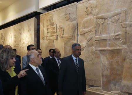 Iraqi Prime Minister Haider al-Abadi (2nd L) visits the Iraqi National Museum in Baghdad February 28, 2015. REUTERS/Khalid al-Mousily