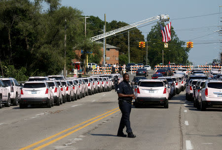 Over one hundred Cadillacs can be seen lined up near the funeral service for Aretha Franklin at the Greater Grace Temple in Detroit, Michigan, U.S., August 31, 2018. REUTERS/Leah Millis