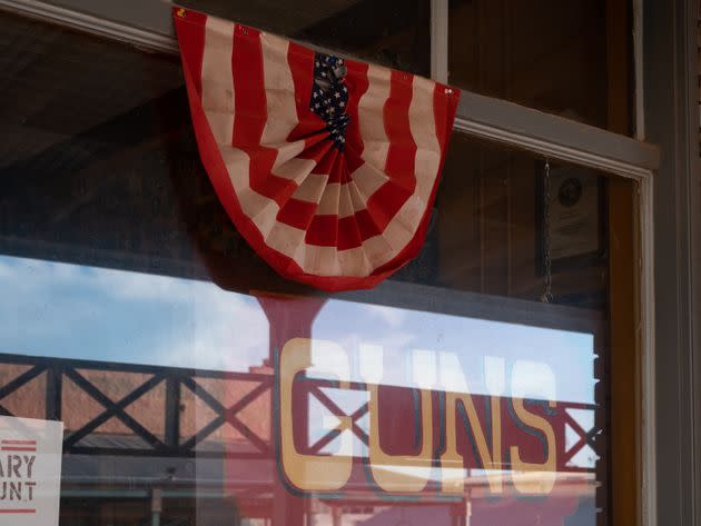 A shop window in Tombstone, Arizona, advertises guns sold inside on Aug. 6, 2022. (Photo: Molly Peters for HuffPost)