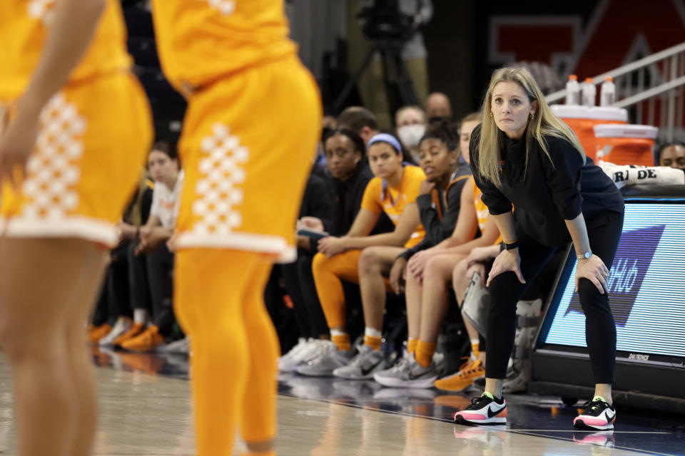 Tennessee head coach Kellie Harper , right, watches the second half of an NCAA college basketball game against Auburn, Thursday, Jan. 27, 2022, in Auburn, Ala. (AP Photo/Butch Dill)