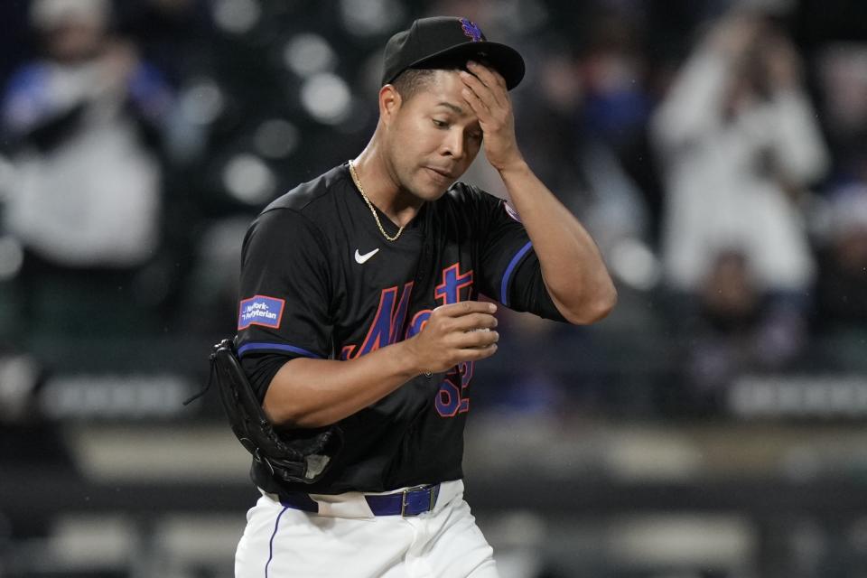New York Mets pitcher Jose Quintana reacts as Atlanta Braves' Ozzie Albies runs the bases on a home run during the third inning of a baseball game Friday, May 10, 2024, in New York. (AP Photo/Frank Franklin II)