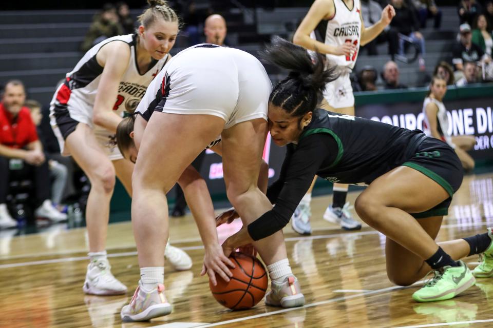 Ypsilanti Arbor Prep’s Autumn Pernell fights for the loose ball against RH Lutheran NW’s Ashley Cadicamo during Arbor Prep's 52-30 win in the MHSAA girls basketball Division 3 semifinals on Thursday, March 21, 2024, at Breslin Center.