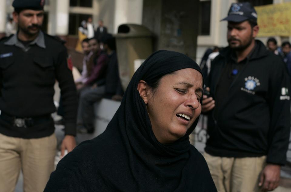 A woman cries over the death of her relative, who was killed in a bomb blast, at a hospital in Lahore