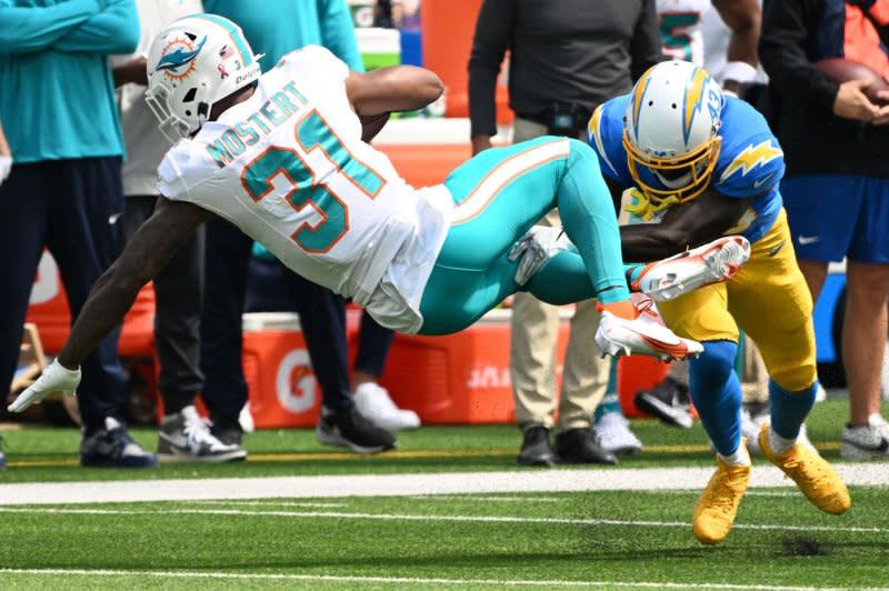 Miami Dolphins running back Raheem Mostert (L) dives for yardage against the Los Angeles Chargers on Sunday in Inglewood, Calif. Photo by Jon SooHoo/UPI