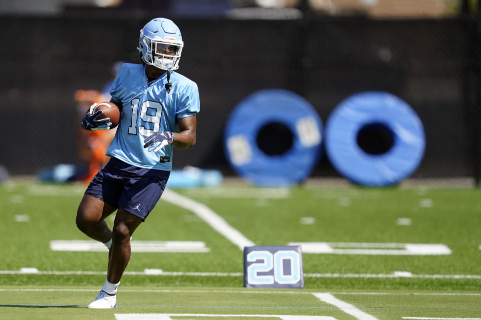 North Carolina running back Ty Chandler runs during an NCAA college football practice in Chapel Hill, N.C., Thursday, Aug. 5, 2021. (AP Photo/Gerry Broome)