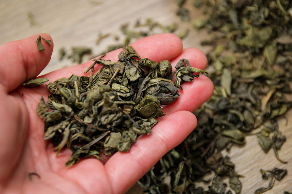 loose-leaf tea in someone's hand