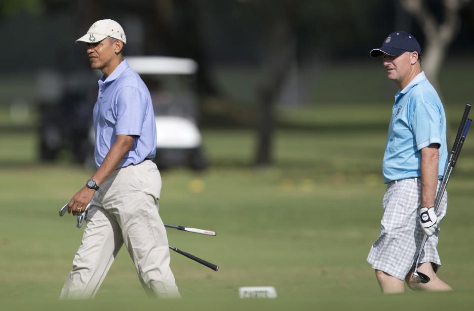 President Barack Obama walks with New Zealand Prime Minister John Key to the second green as they golf at Kaneohe Klipper Golf Course on Marine Corps Base Hawaii in Kaneohe Bay, Hawaii, Thursday, Jan. 2, 2014. The first family is in Hawaii for their annual holiday vacation. (AP Photo/Carolyn Kaster)