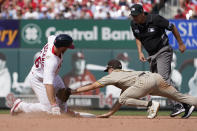 St. Louis Cardinals' Paul Goldschmidt, left, is safe at second for a double ahead of the tag from San Diego Padres second baseman Adam Frazier during the fifth inning of a baseball game Sunday, Sept. 19, 2021, in St. Louis. (AP Photo/Jeff Roberson)