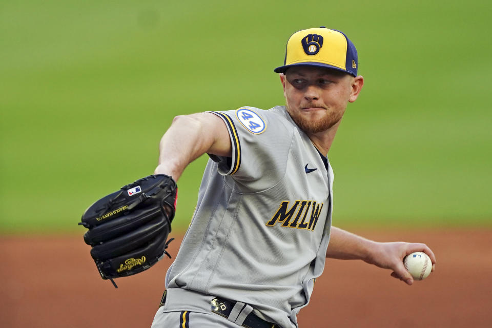 Milwaukee Brewers starting pitcher Eric Lauer delivers in the second inning of a baseball game against the Atlanta Braves, Friday, May 6, 2022, in Atlanta. (AP Photo/John Bazemore)