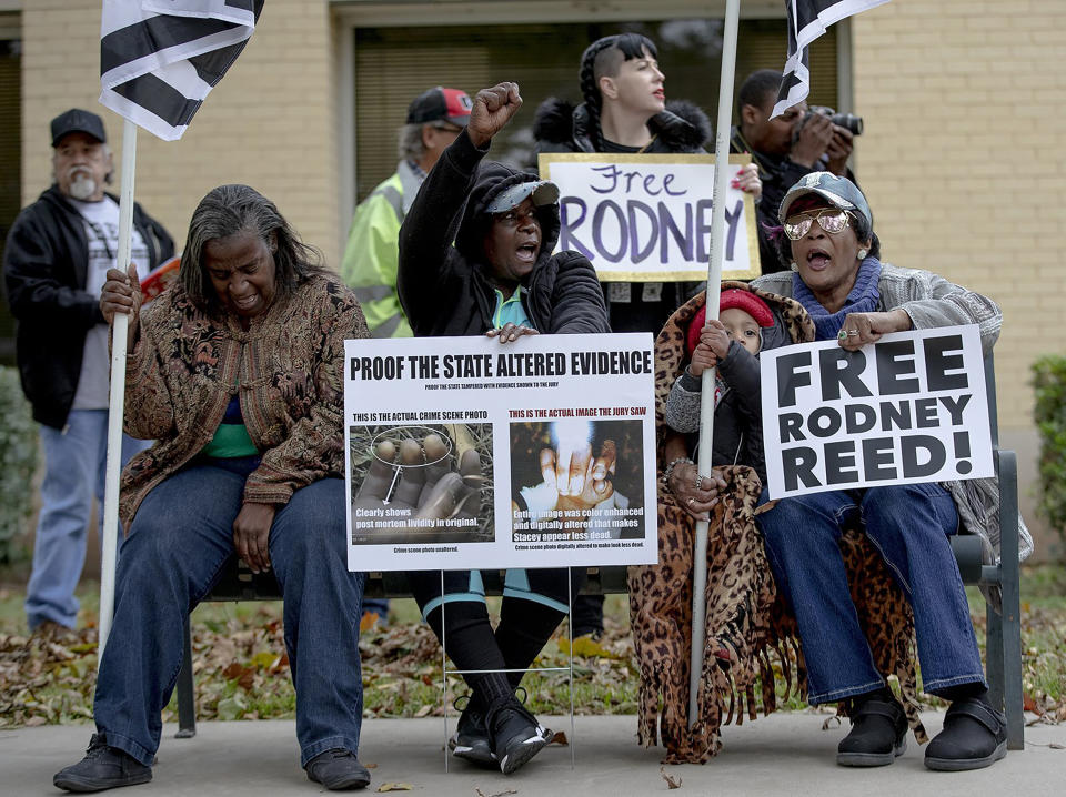 People chant during a protest against the execution of Rodney Reed on Wednesday, Nov. 13, 2019, in Bastrop, Texas. New evidence in the case has led a growing number of Texas legislators, religious leaders and celebrities to press Gov. Greg Abbott to intervene. (Nick Wagner/Austin American-Statesman via AP)