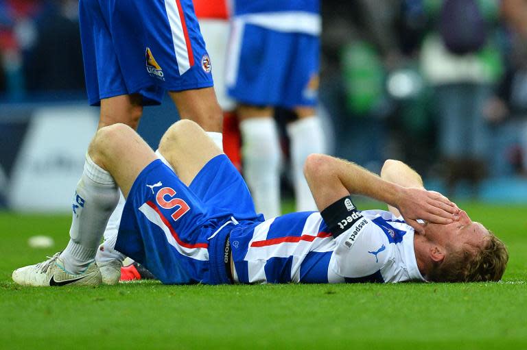 Reading captain Alex Pearce reacts after losing 2-1 in the FA Cup semi-final against Arsenal at Wembley stadium on April 18, 2015