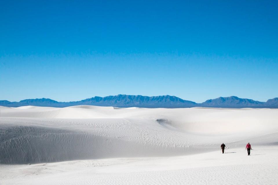 Hikers make their way through a five mile loop trail in the heart of the dunes.