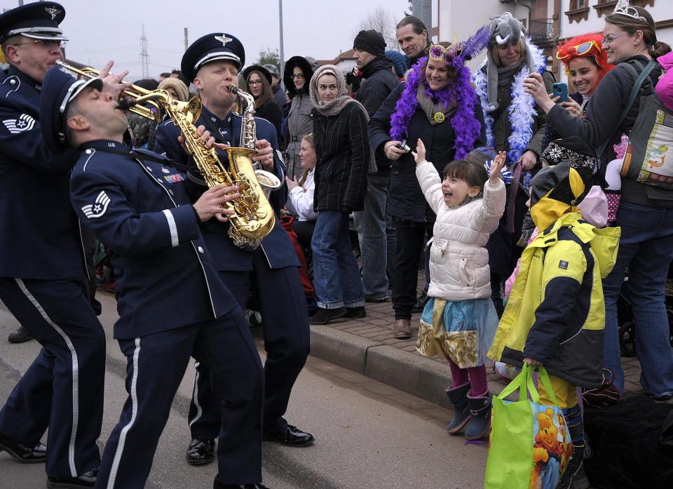 Members of the U.S. Air Forces in Europe Band interact with the crowd during the Fasching parade Feb. 17, 2015, in Ramstein-Miesenbach, Germany. The USAFE Band and about 1,400 other participants marched in the parade for more than two hours entertaining the crowd. 