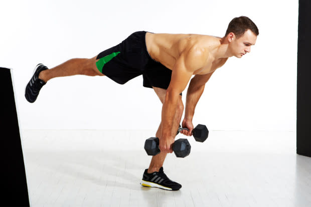 How to do it:<ol><li>Stand tall with a dumbbell in each hand, arms to your sides. Put some slack in your knees so they're in a neutral position, slightly bent. </li><li>Step one leg back; this non-weight-bearing leg should extend straight back until it's parallel to the floor, while your planted leg remains engaged and planted firmly to the floor. </li><li>As you draw your elevated leg back, bend at the hips as far as you can without losing the arch in your lower back. Your weight-bearing knee should be neutral to just slightly bent to avoid hyperextension. </li><li>Sink your arms toward the floor. Use your glutes to pull yourself back to the upright position. That's one rep.</li></ol>