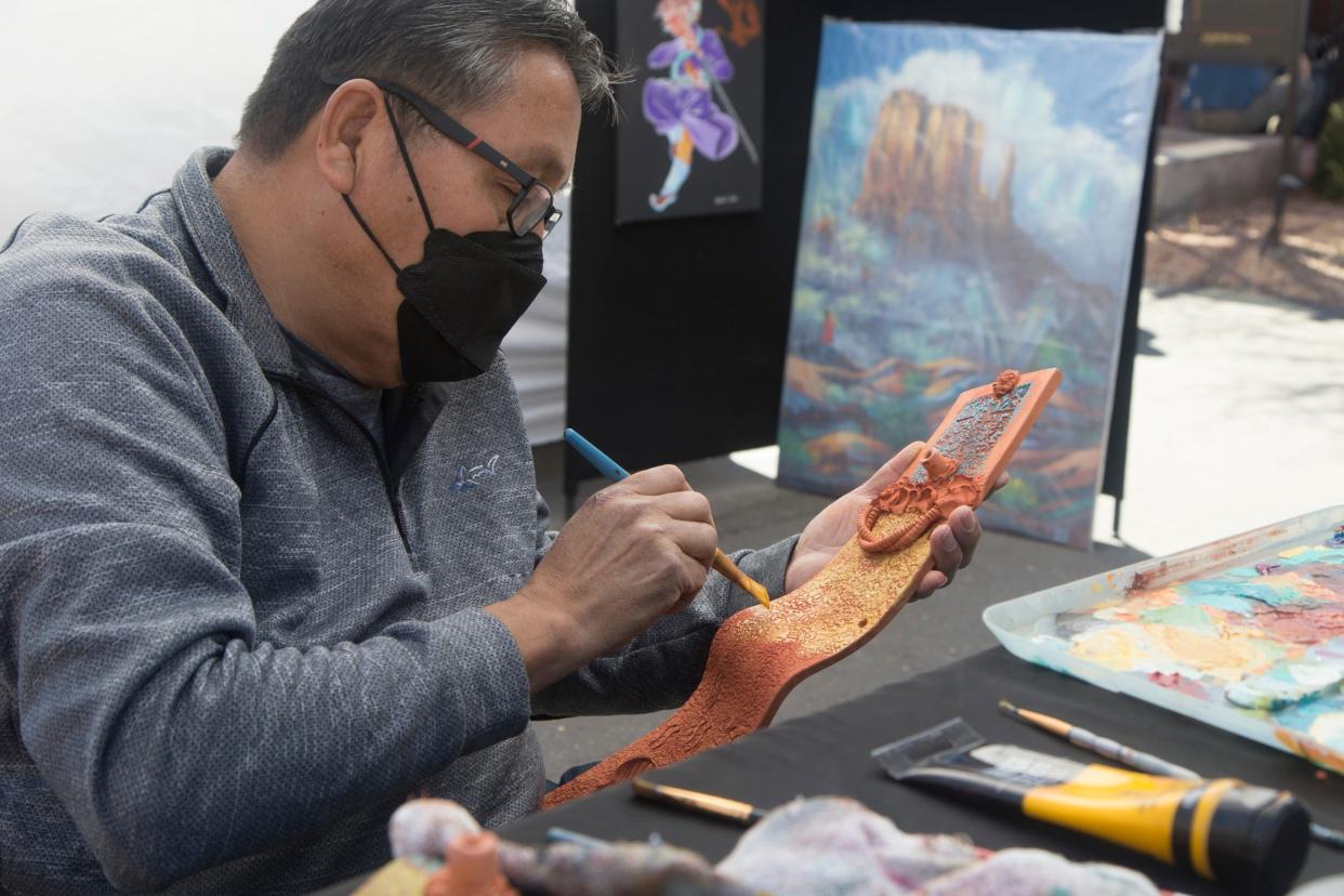An artist at the 2022 version of the Kayenta Art Festival works on a piece. The popular annual festival returns for 2023 on Feb. 18 and 19.