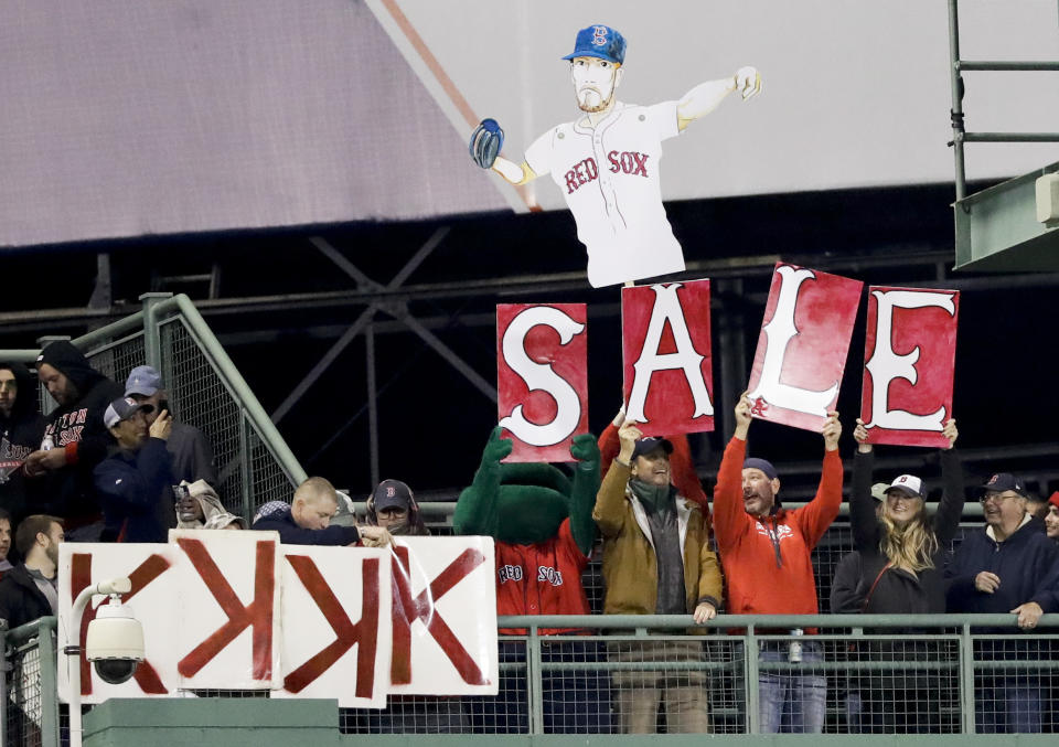 Fans cheer for Boston Red Sox starting pitcher Chris Sale during the fourth inning in Game 1 of a baseball American League Championship Series against the Houston Astros on Saturday, Oct. 13, 2018, in Boston. (AP Photo/David J. Phillip)