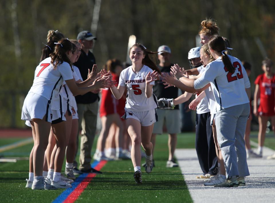 The Wappinger girls lacrosse team cheer on Kaylee Reaves before their game versus Tappan Zee on April 25, 2024.