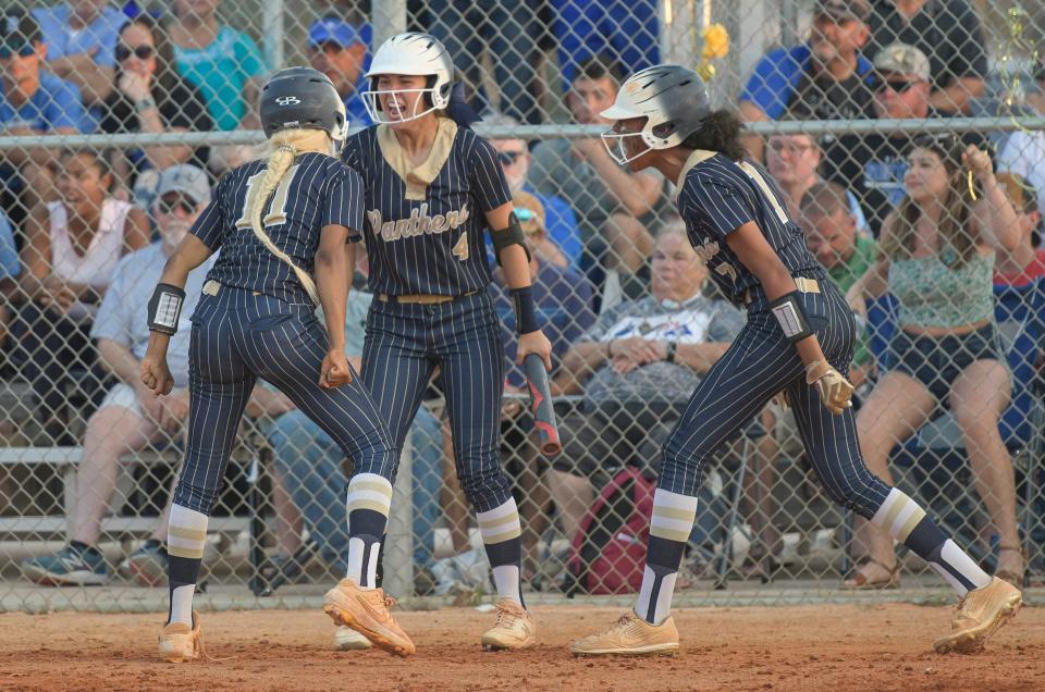 Eustis teammates Ainsley Perdicaris (4) and Ciara Maple (7) cheer after Dyani McKinley (11) scores during Monday's Class 4A-Region 2 championship game against Deltona at the Panther Den in Eustis.