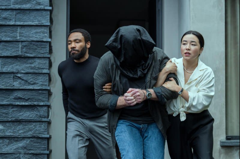 Mr. and Mrs. Smith (Donald Glover and Maya Erskine) retrieve an asset, Photo courtesy of Prime Video