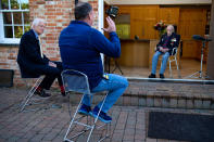 Former cricketer David Gower (left)alongside Captain Sir Tom Moore and Lloyd Scott (centre), at the launch event for Scott's Three Peaks Challenge at Captain Tom's home in Marston Moretaine, Bedfordshire. The veteran fundraiser will attempt to climb the Three Peaks whilst wearing a deep sea diving suit.