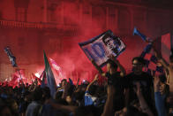 Napoli fans celebrate Thursday, May 4, 2023, in Naples, Italy, after their soccer team won the Serie A soccer title. The southern team sealed the trophy with a 1-1 draw at Udinese. (Alessandro Garofalo/LaPresse via AP)
