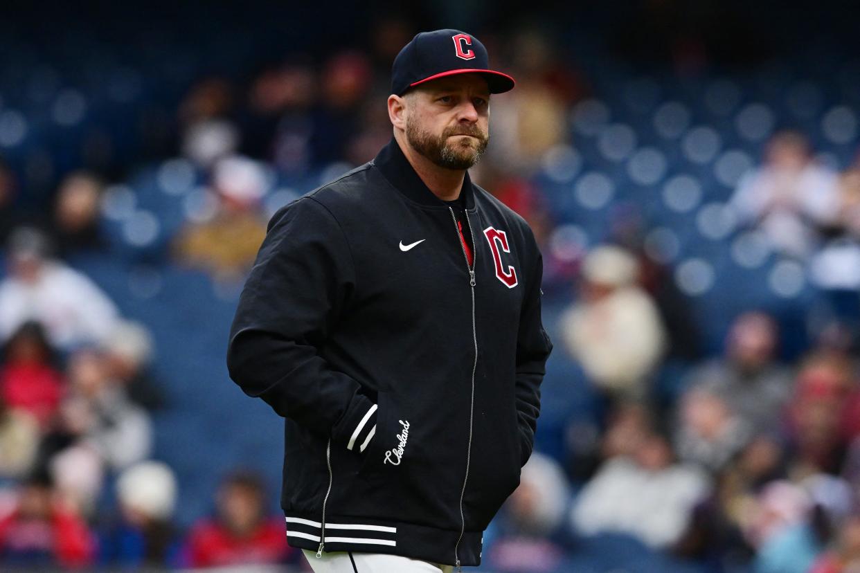 Cleveland Guardians manager Stephen Vogt walks back to the dugout after relieving starting pitcher Carlos Carrasco (59) during the sixth inning against the Boston Red Sox on April 24 in Cleveland.