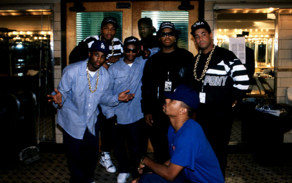 Rapper and producer Dr. Dre (Andre Romelle Young), Laylaw (Larry Goodman) of Above The Law, (rear) MC Ren (Lorenzo Jerald Patterson), Eazy-E (Eric Lynn Wright), Ice Cube (O'Shea Jackson) and DJ Yella (Antoine Carraby) of N.W.A. poses for photos with rapper The D.O.C. (Tracy Lynn Curry) (front) after their performances during the 'Straight Outta Compton' tour at the Mecca Arena in Milwaukee, Wisconsin in June 1989. (Photo By Raymond Boyd/Getty Images)